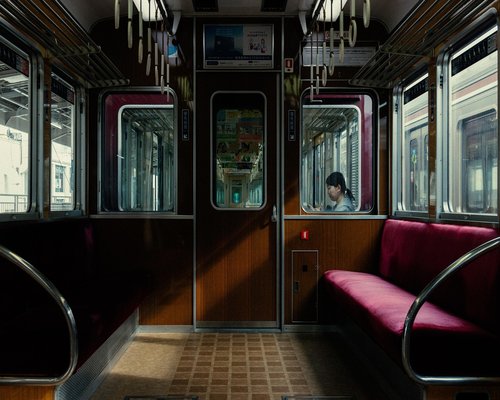 person stretching happily next to bed during sunrise representing morning routine