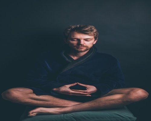 person meditating during sunrise for inner balance